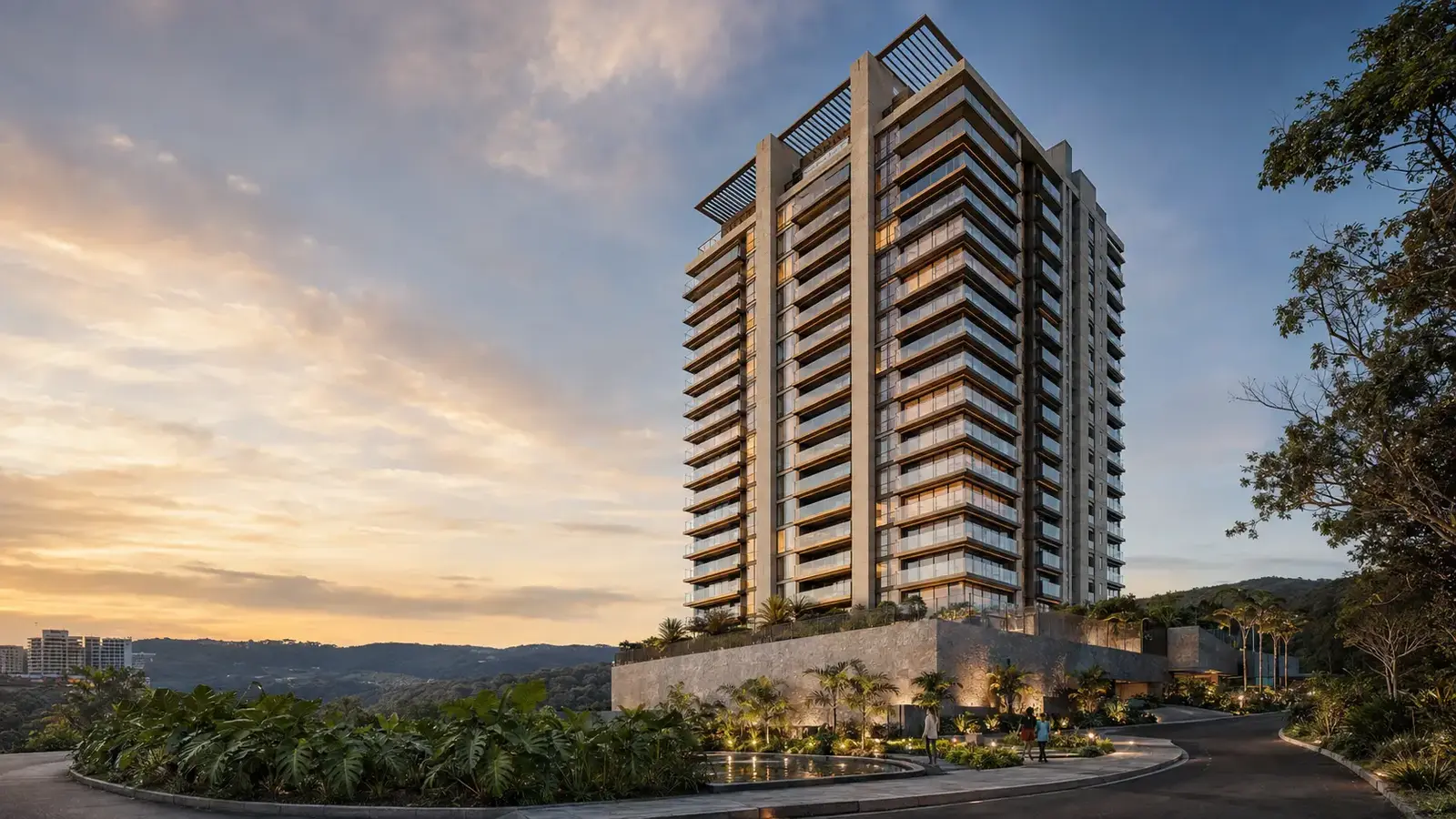 Áurea Residence ao entardecer, com luzes internas acesas, paisagismo iluminado e moradores no jardim